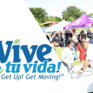 Logo reading “¡Vive tu vida! Get Up! Get Moving!” on the left; on the right, people gather outdoors at tents and booths during a sunny community health event.
